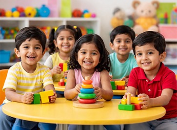 Playgroup kids playing games in classroom